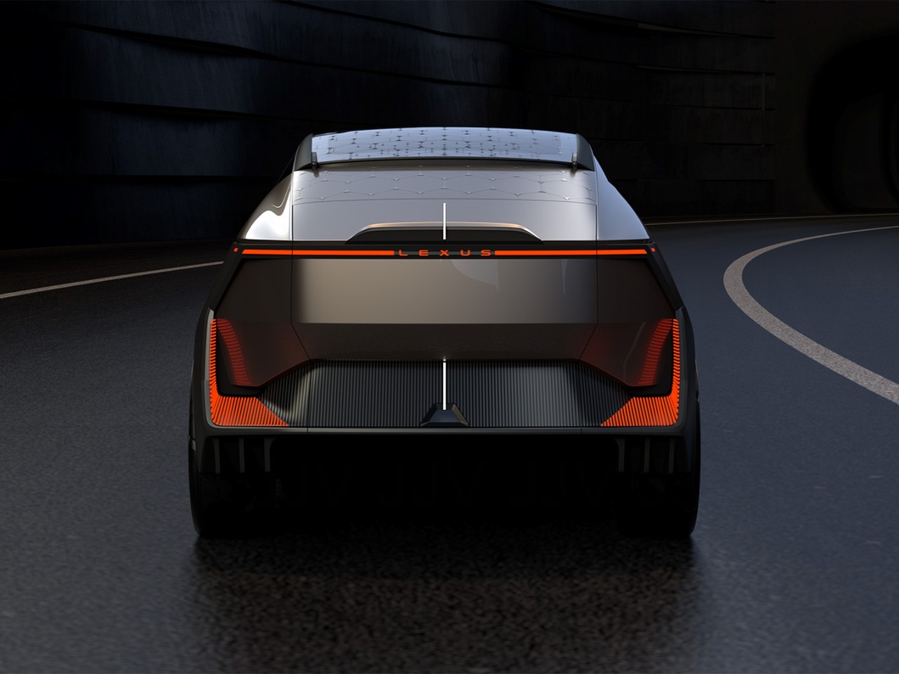 A rear view of the LF-ZL Concept car driving on a road